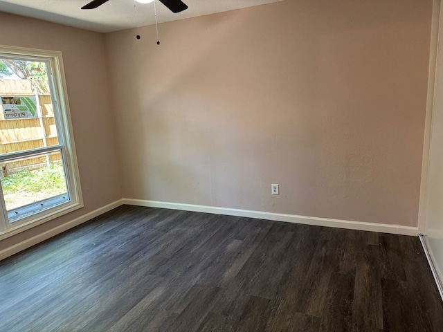 711 Ticonderoga Dr, Garland, TX 75043 - spare room featuring ceiling fan and dark wood-type flooring