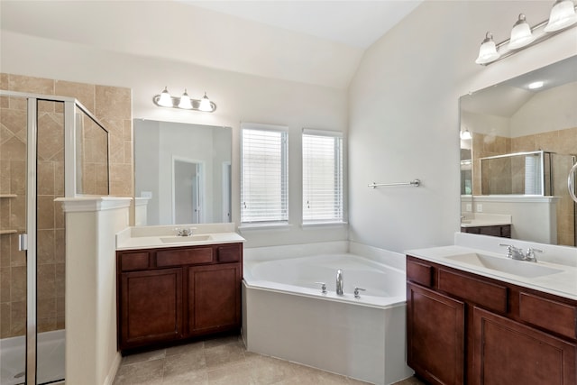 3408 Glen Crest Ln, Denton, TX 76208 - bathroom with a shower stall, lofted ceiling, two vanities, and a bath