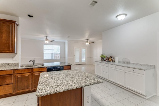 4908 Blue Top Dr, Fort Worth, TX 76179 - kitchen featuring a ceiling fan, black dishwasher, light tile patterned floors, and a center island