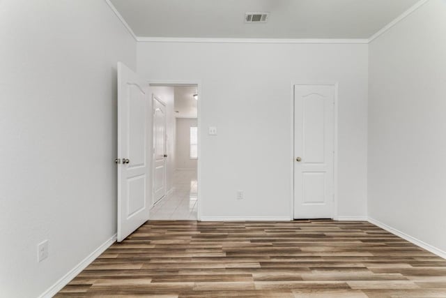 4908 Blue Top Dr, Fort Worth, TX 76179 - unfurnished bedroom with wood finished floors and ornamental molding