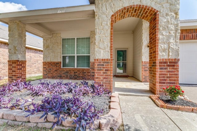 4908 Blue Top Dr, Fort Worth, TX 76179 - property entrance featuring brick siding, an attached garage, and stone siding