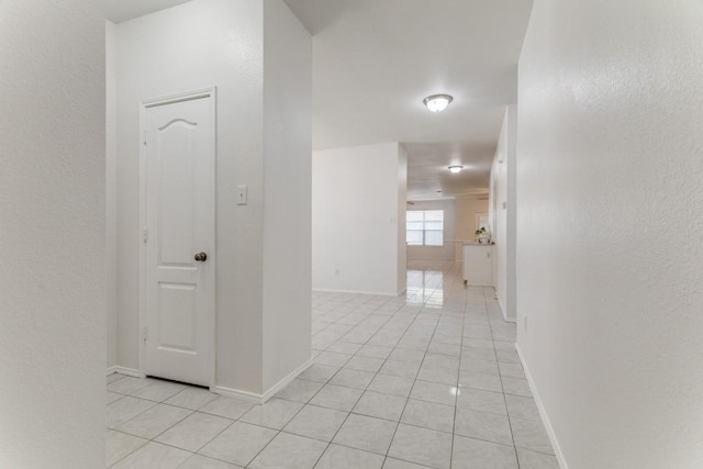 4908 Blue Top Dr, Fort Worth, TX 76179 - hall with light tile patterned flooring and a textured wall