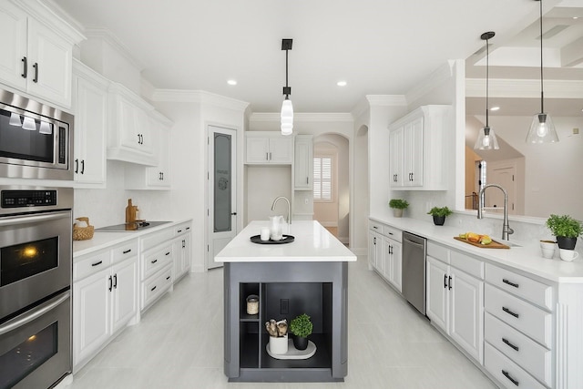 149 Silver Valley Ln, Fort Worth, TX 76108 - kitchen with appliances with stainless steel finishes, crown molding, arched walkways, light countertops, and white cabinets