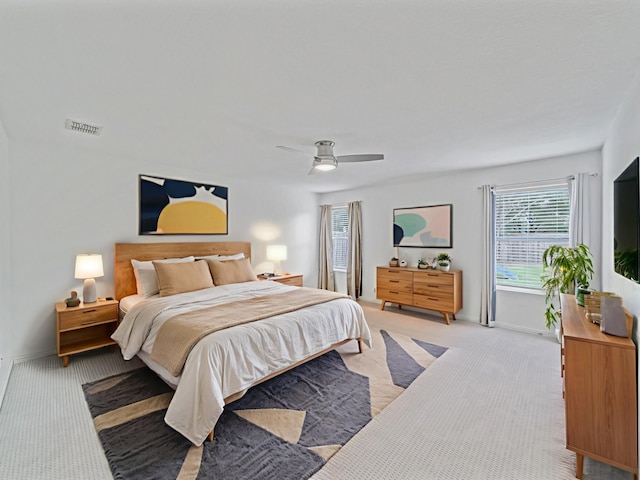 2321 Live Oak Dr, Little Elm, TX 75068 - bedroom featuring light colored carpet, multiple windows, and a ceiling fan