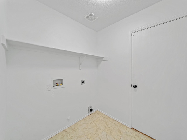 2321 Live Oak Dr, Little Elm, TX 75068 - washroom featuring washer hookup, hookup for a gas dryer, electric dryer hookup, and light marble finish flooring