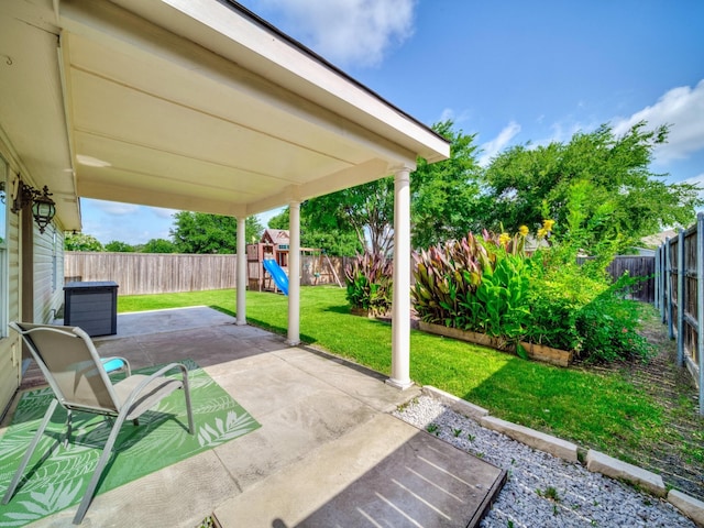 2321 Live Oak Dr, Little Elm, TX 75068 - fenced backyard featuring a playground and a patio