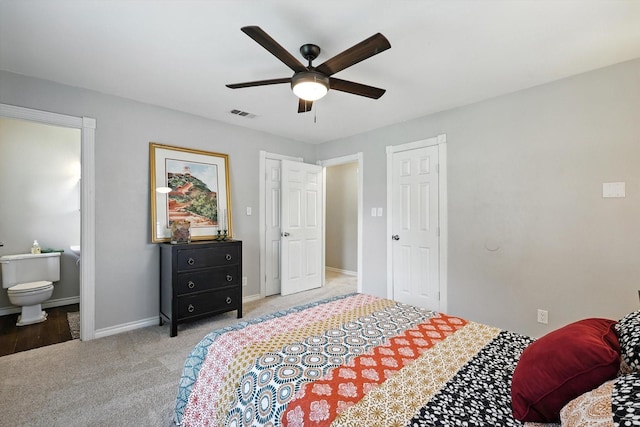 200 Arcadia St, Hurst, TX 76053 - carpeted bedroom with ensuite bath and a ceiling fan