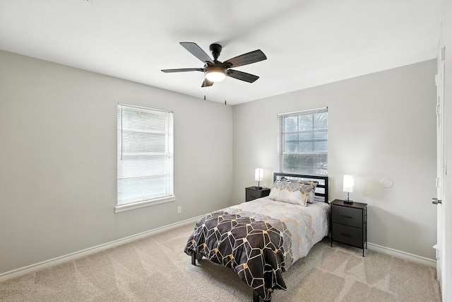 200 Arcadia St, Hurst, TX 76053 - carpeted bedroom with baseboards and a ceiling fan