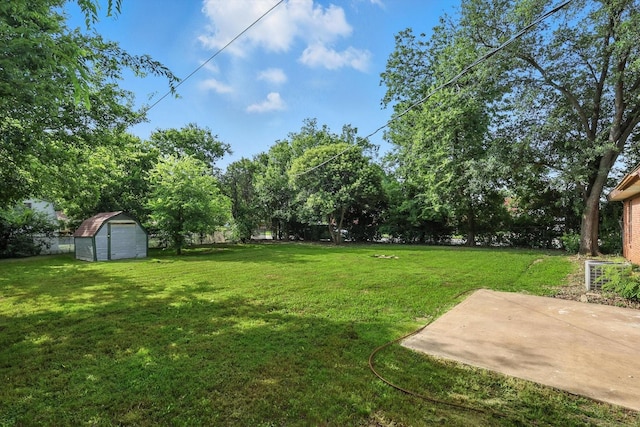 200 Arcadia St, Hurst, TX 76053 - view of grassy yard featuring a storage unit and a patio