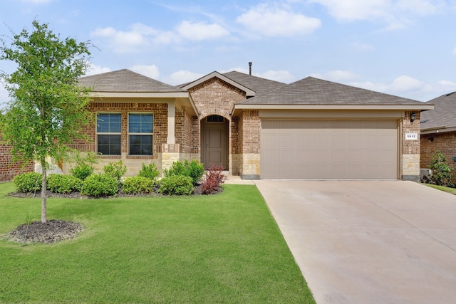 5912 Piedrosa Ct, Denton, TX 76226 - view of front facade with brick siding, driveway, a front yard, and a garage