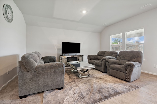5912 Piedrosa Ct, Denton, TX 76226 - tiled living room with vaulted ceiling and carpet flooring