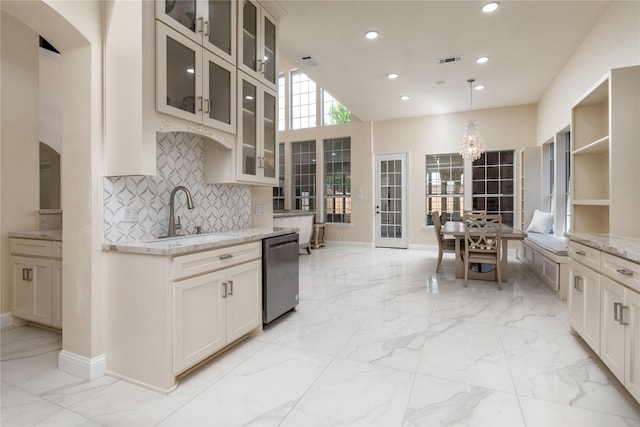6608 Terrace Mill Ln, Plano, TX 75024 - kitchen featuring stainless steel dishwasher, light marble finish flooring, a chandelier, tasteful backsplash, and recessed lighting
