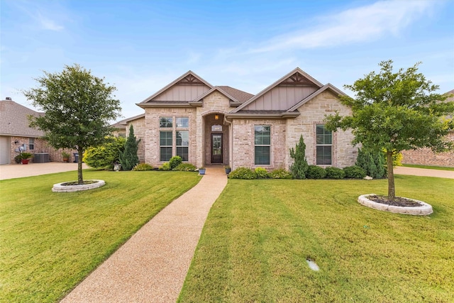 10309 Creekside Ln, Waco, TX 76712 - craftsman inspired home with board and batten siding, a front lawn, and brick siding