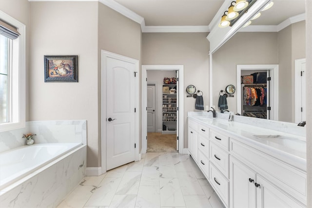 10309 Creekside Ln, Waco, TX 76712 - bathroom featuring ornamental molding, a bath, double vanity, a spacious closet, and marble finish floors