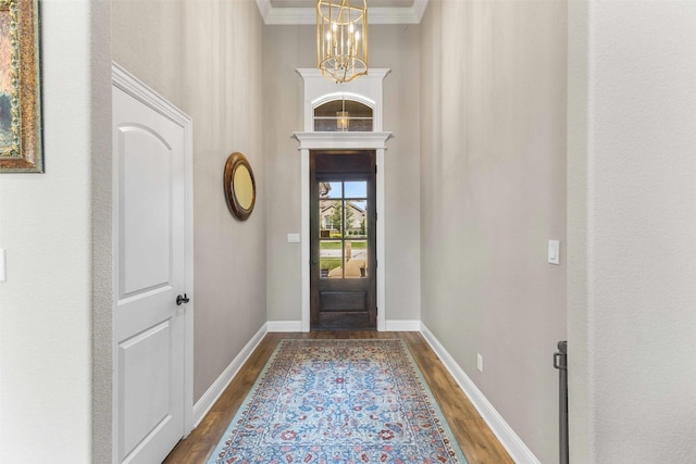 10309 Creekside Ln, Waco, TX 76712 - foyer entrance with dark wood-style flooring, crown molding, and a chandelier