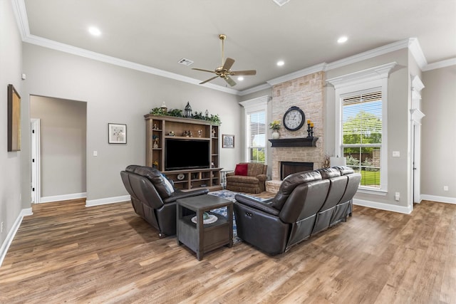 10309 Creekside Ln, Waco, TX 76712 - living area featuring a ceiling fan, light wood-style flooring, a fireplace, crown molding, and recessed lighting