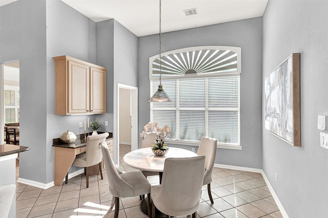 5405 Enfield Dr, Richardson, TX 75082 - dining space featuring light tile patterned flooring and a towering ceiling
