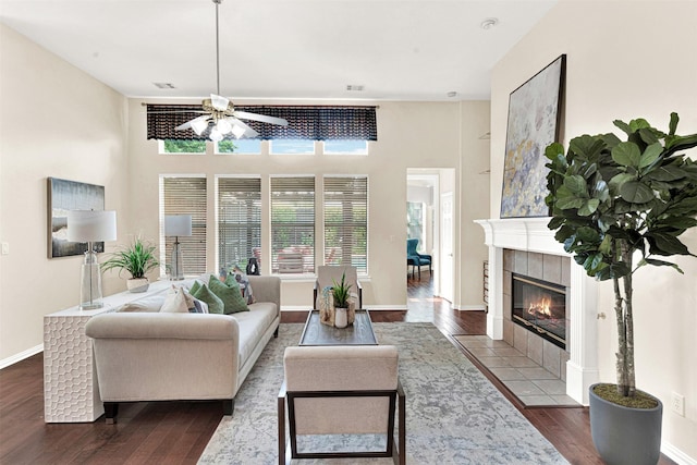 5405 Enfield Dr, Richardson, TX 75082 - living area featuring a ceiling fan, dark wood-style floors, and a fireplace