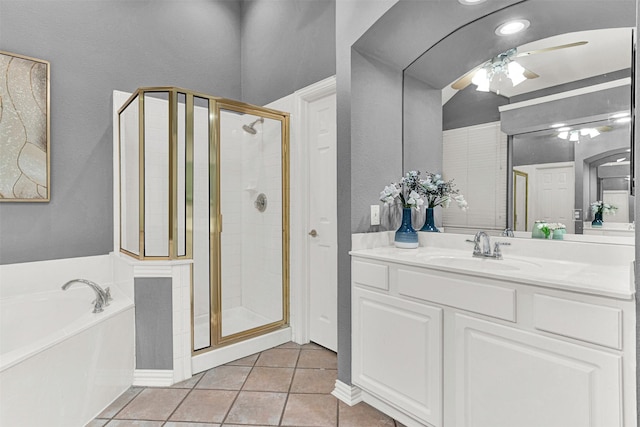 5405 Enfield Dr, Richardson, TX 75082 - bathroom with a shower stall, a garden tub, vanity, a ceiling fan, and tile patterned flooring