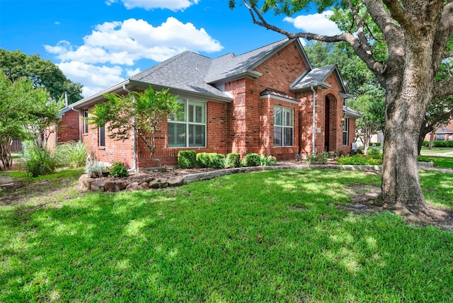 5405 Enfield Dr, Richardson, TX 75082 - view of front facade featuring brick siding, a front yard, and roof with shingles
