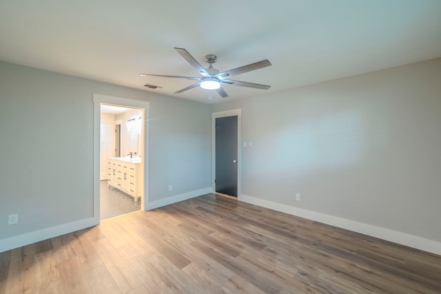 5209 Cordova Ave, Fort Worth, TX 76132 - unfurnished bedroom featuring wood finished floors, ensuite bathroom, and a ceiling fan