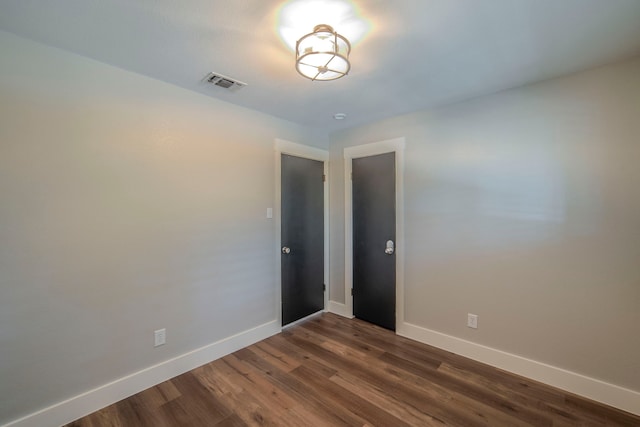 5209 Cordova Ave, Fort Worth, TX 76132 - empty room featuring baseboards and dark wood finished floors