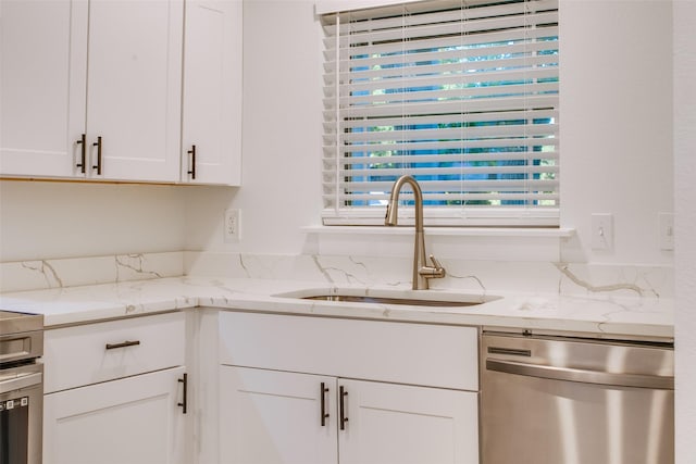431 S Locust St, Mesquite, TX 75149 - kitchen featuring dishwasher, white cabinetry, and light stone counters