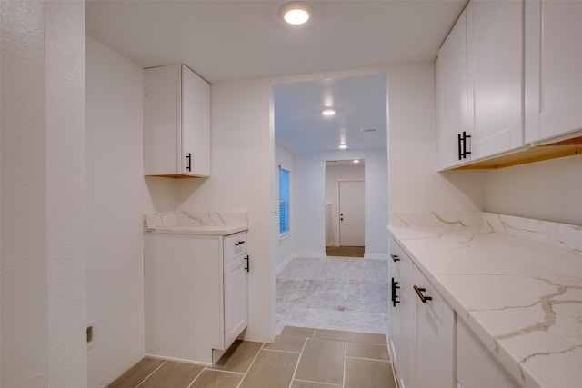 431 S Locust St, Mesquite, TX 75149 - kitchen with light stone counters, white cabinetry, light tile patterned flooring, and recessed lighting