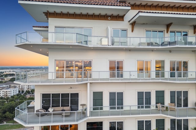 2800 Lakeside Pkwy Unit 1502, Flower Mound, TX 75022 - back of house featuring a balcony, stucco siding, and a tiled roof
