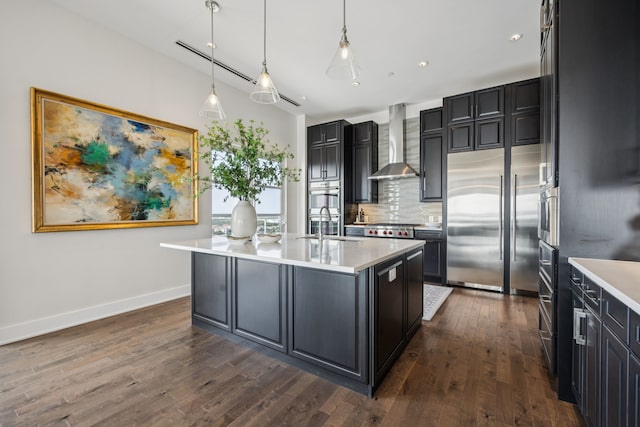 2800 Lakeside Pkwy Unit 1502, Flower Mound, TX 75022 - kitchen with wall chimney exhaust hood, appliances with stainless steel finishes, backsplash, light countertops, and dark wood finished floors