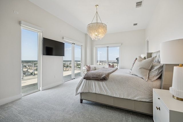 2800 Lakeside Pkwy Unit 1502, Flower Mound, TX 75022 - bedroom with access to outside, a chandelier, and carpet