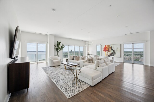2800 Lakeside Pkwy Unit 1502, Flower Mound, TX 75022 - living room with dark wood-style flooring and a chandelier