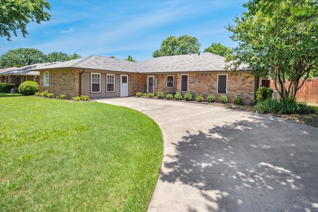 821 Sandpiper Dr, Denton, TX 76205 - single story home with driveway and brick siding