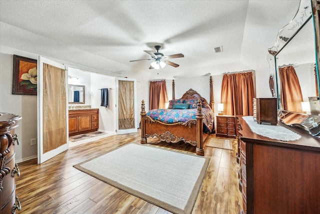 821 Sandpiper Dr, Denton, TX 76205 - bedroom featuring light wood-style floors, a ceiling fan, and ensuite bathroom