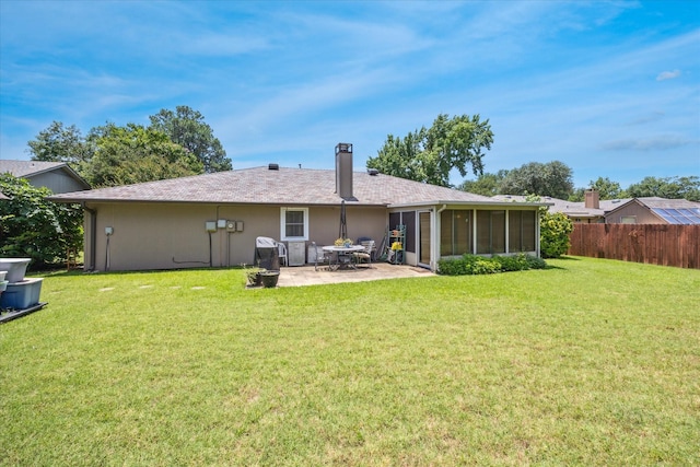 821 Sandpiper Dr, Denton, TX 76205 - rear view of property featuring a sunroom and a patio