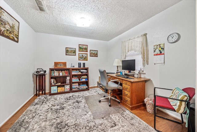 821 Sandpiper Dr, Denton, TX 76205 - office with a textured ceiling and wood finished floors