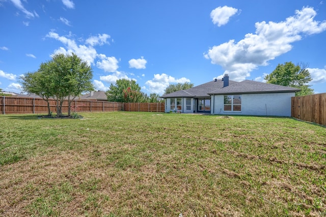 123 Rolling Spring Dr, Aledo, TX 76008 - back of house featuring a fenced backyard, brick siding, and a chimney