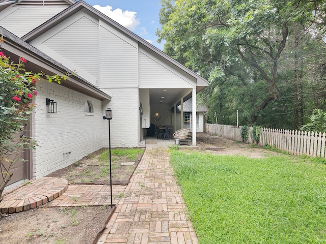 915 Slippery Elm Dr, Ovilla, TX 75154 - back of house featuring a patio area and brick siding