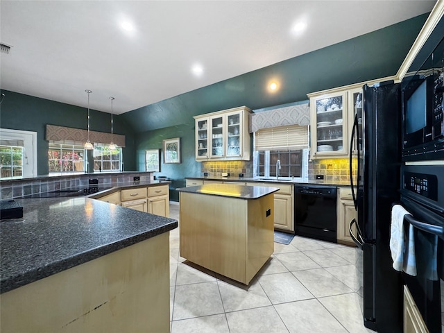 2629 Valley Creek Trl, Mckinney, TX 75072 - kitchen featuring black appliances, decorative backsplash, a spacious island, lofted ceiling, and light tile patterned floors