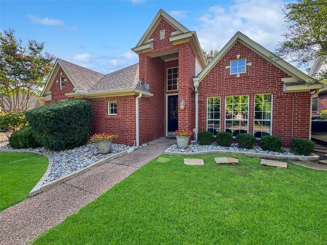 2629 Valley Creek Trl, Mckinney, TX 75072 - view of front of property featuring brick siding, roof with shingles, and a front yard