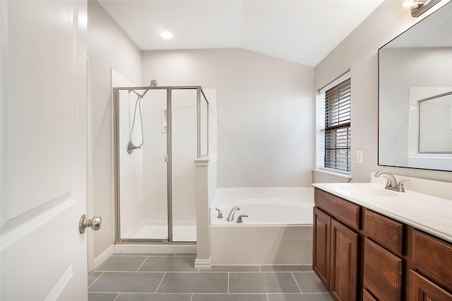 1511 Biltmore Ln, Irving, TX 75063 - full bath featuring a shower stall, a garden tub, vanity, tile patterned floors, and vaulted ceiling