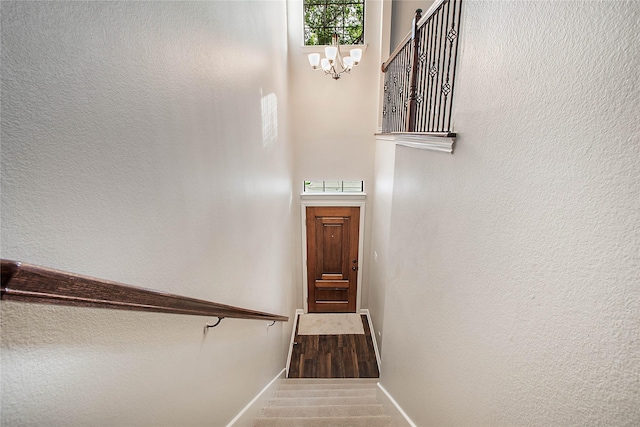 1511 Biltmore Ln, Irving, TX 75063 - stairway featuring baseboards and a chandelier