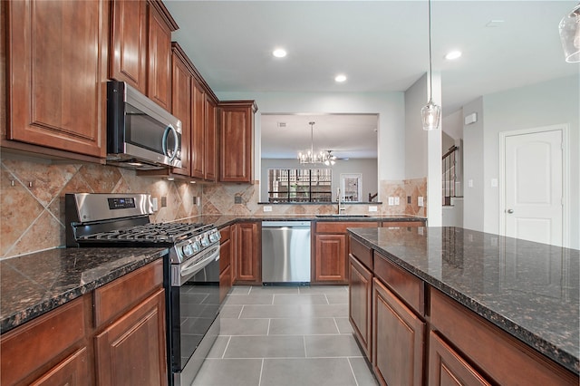 1511 Biltmore Ln, Irving, TX 75063 - kitchen with appliances with stainless steel finishes, tasteful backsplash, brown cabinetry, light tile patterned flooring, and recessed lighting