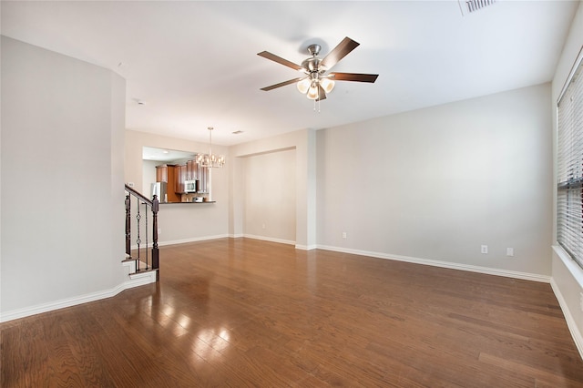 1511 Biltmore Ln, Irving, TX 75063 - unfurnished living room with a chandelier, a ceiling fan, wood finished floors, and stairs
