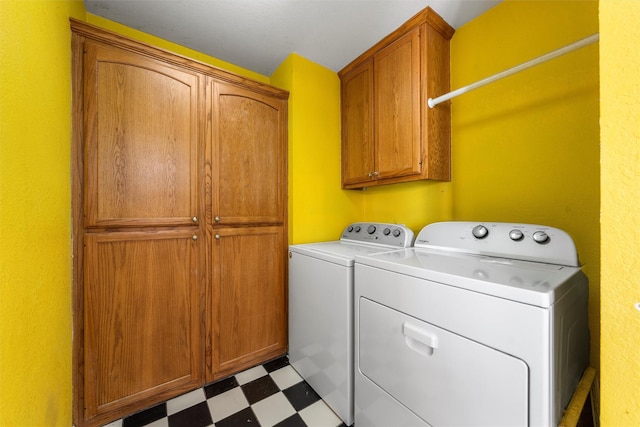 705 Tahoe Trail Dr, Hewitt, TX 76643 - laundry area featuring washing machine and clothes dryer, tile patterned floors, and cabinet space