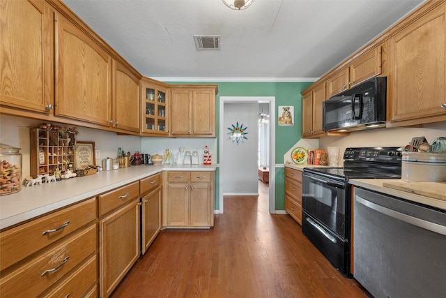 705 Tahoe Trail Dr, Hewitt, TX 76643 - kitchen featuring black appliances, light countertops, dark wood-style floors, glass insert cabinets, and ornamental molding