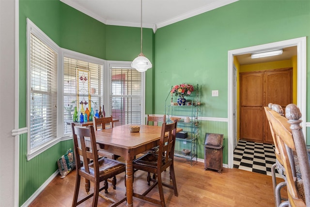 705 Tahoe Trail Dr, Hewitt, TX 76643 - dining area with crown molding, wainscoting, and light wood-style flooring