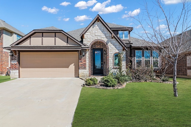 108 Gateway Dr, Alvarado, TX 76009 - view of front facade with stone siding, concrete driveway, a garage, and a front yard