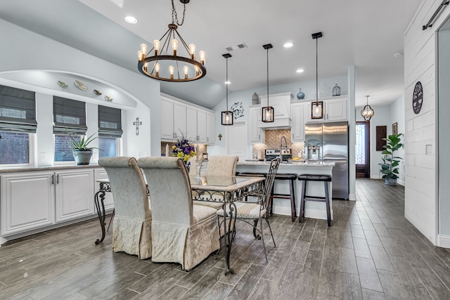 108 Gateway Dr, Alvarado, TX 76009 - dining space with a chandelier, dark wood-style floors, recessed lighting, and vaulted ceiling