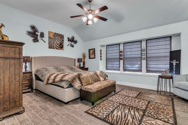 108 Gateway Dr, Alvarado, TX 76009 - bedroom with vaulted ceiling, a ceiling fan, and wood finished floors